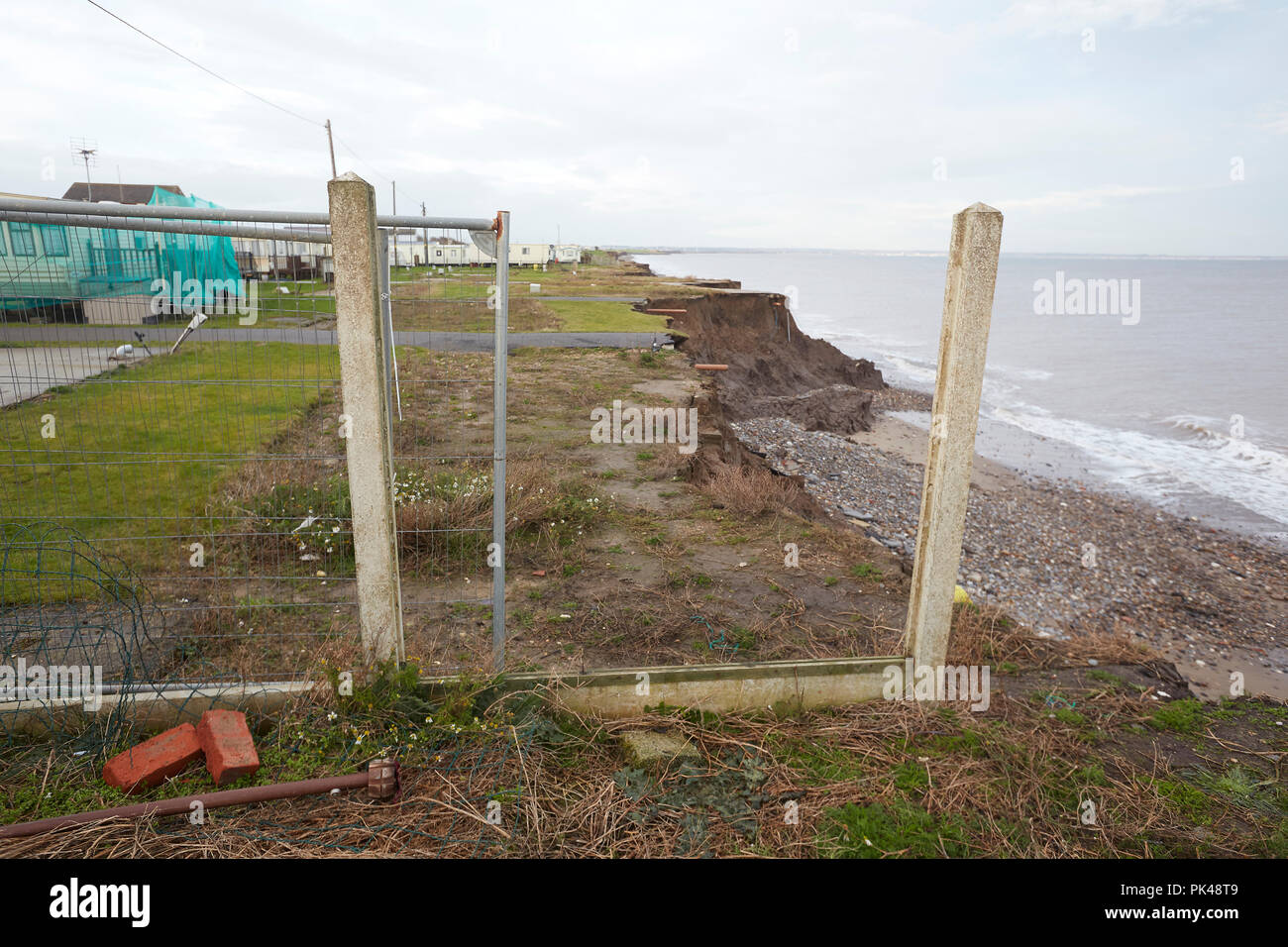 Coastal Erosion cliffs, remains of a caravan site that has collapsed into the North Sea, Ulrome, Skipsea, East Riding of Yorkshire, England, UK Stock Photo