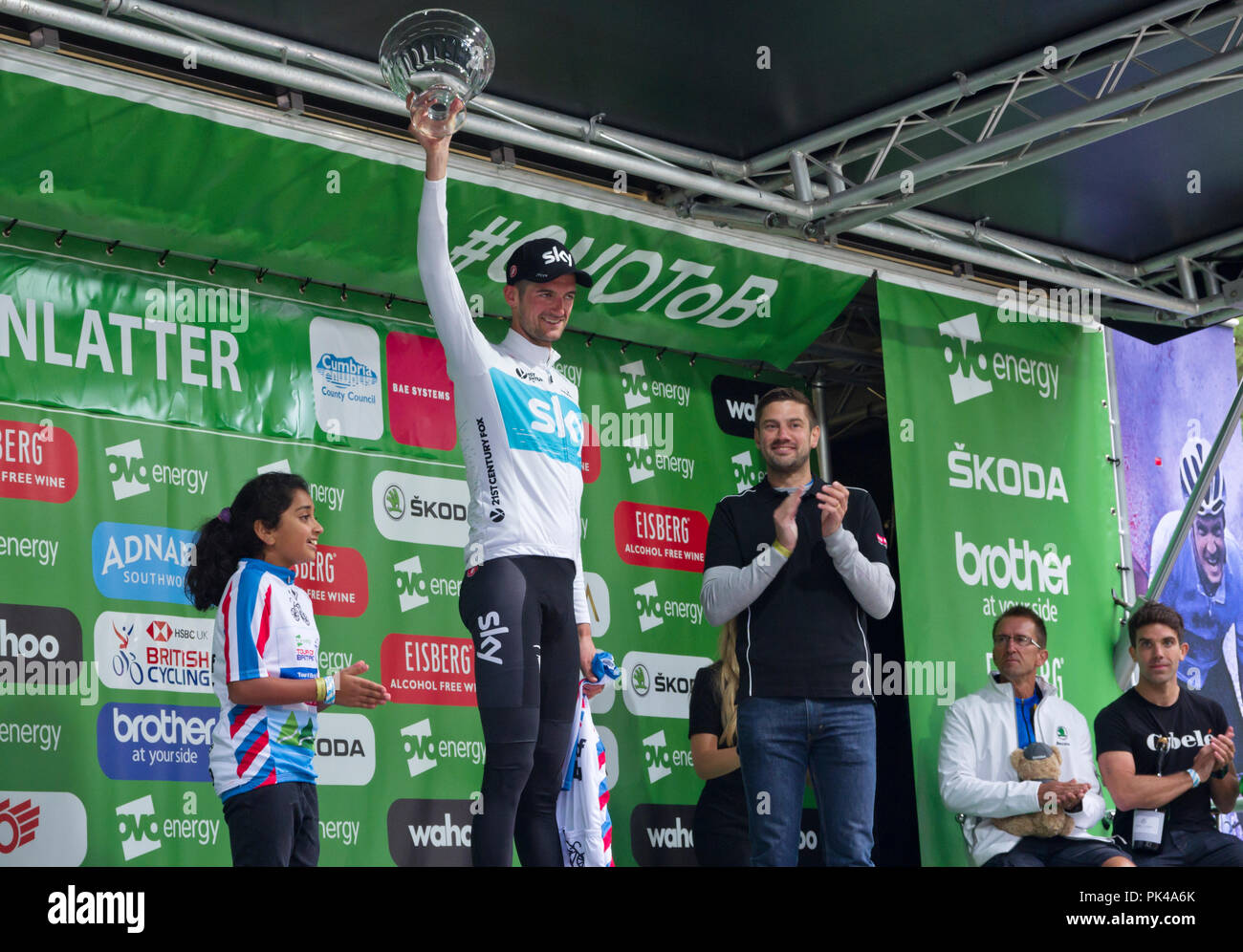 7th September 2018. Stage 6, Tour of Britain. Stage winner Wout Poels, Team Sky, receiving trophy and winner's jersey at Whinlatter Visitor Centre.. Stock Photo