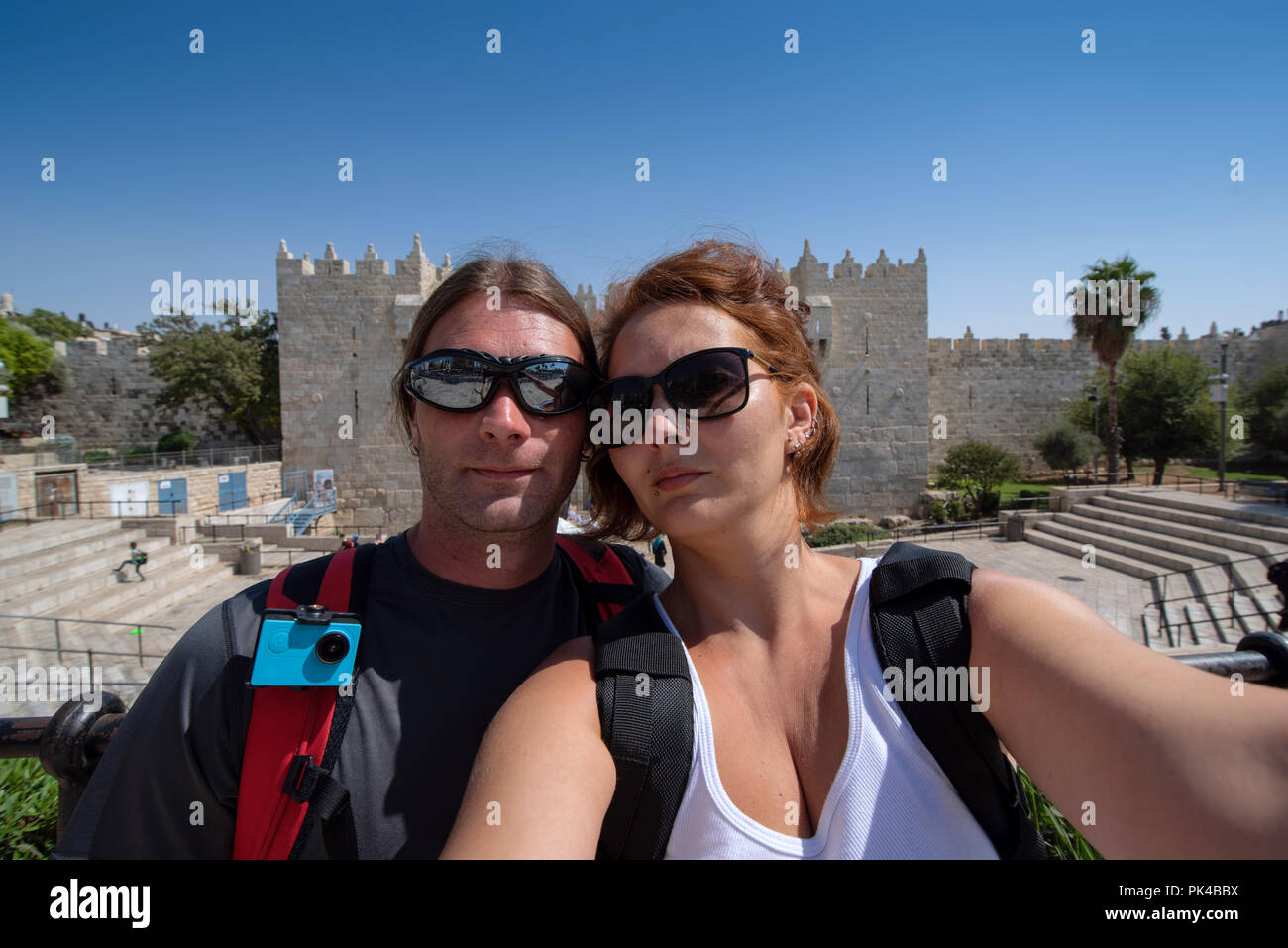 Young couple shot a selfie picture in front of a wall gate in Jerusalem Stock Photo