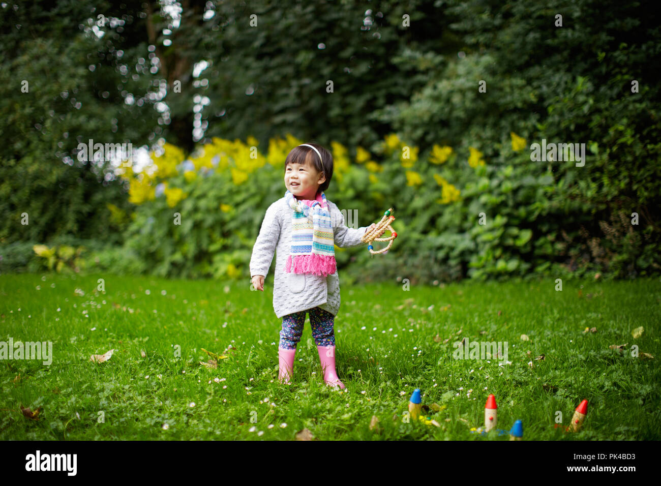 baby girl play in Summer forest park Stock Photo - Alamy