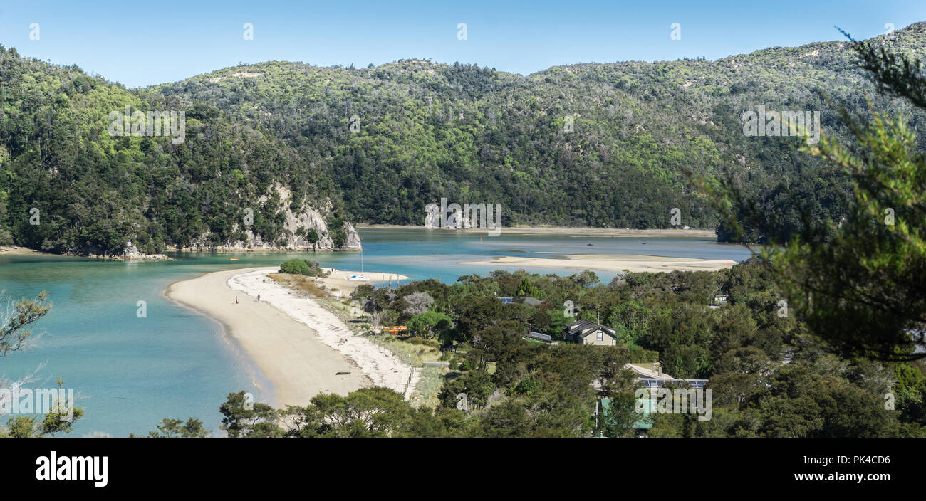 Village In Abel Tasman Costal Track - South Pacific Pristine Blue With Clear Blue Sky And Sandy Beach Stock Photo