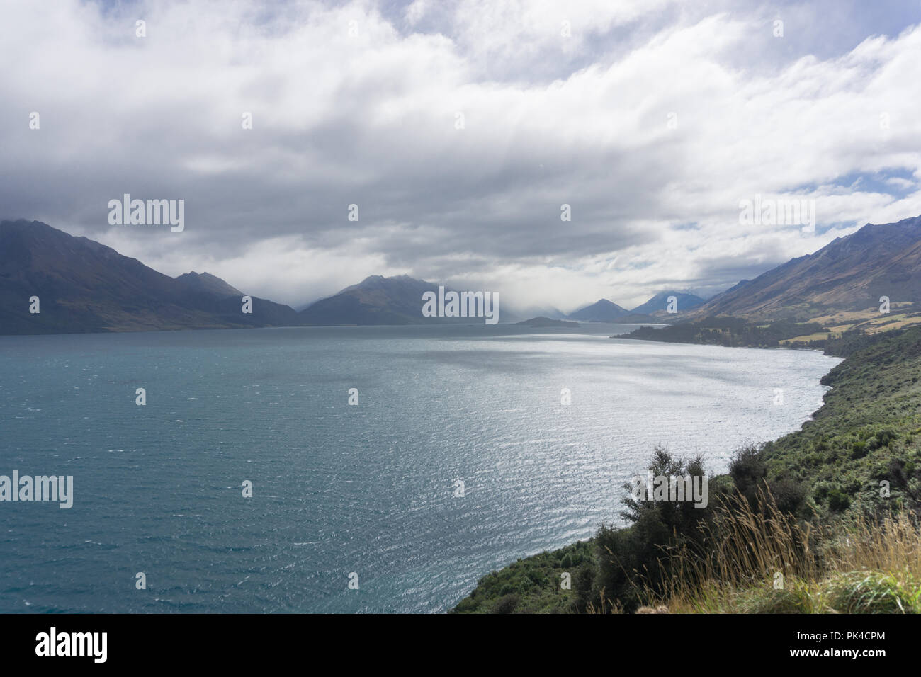 Mountain Views In Glenorchy New Zealand Mystical Blue Lake Blue Sky Foggy Stock Photo Alamy