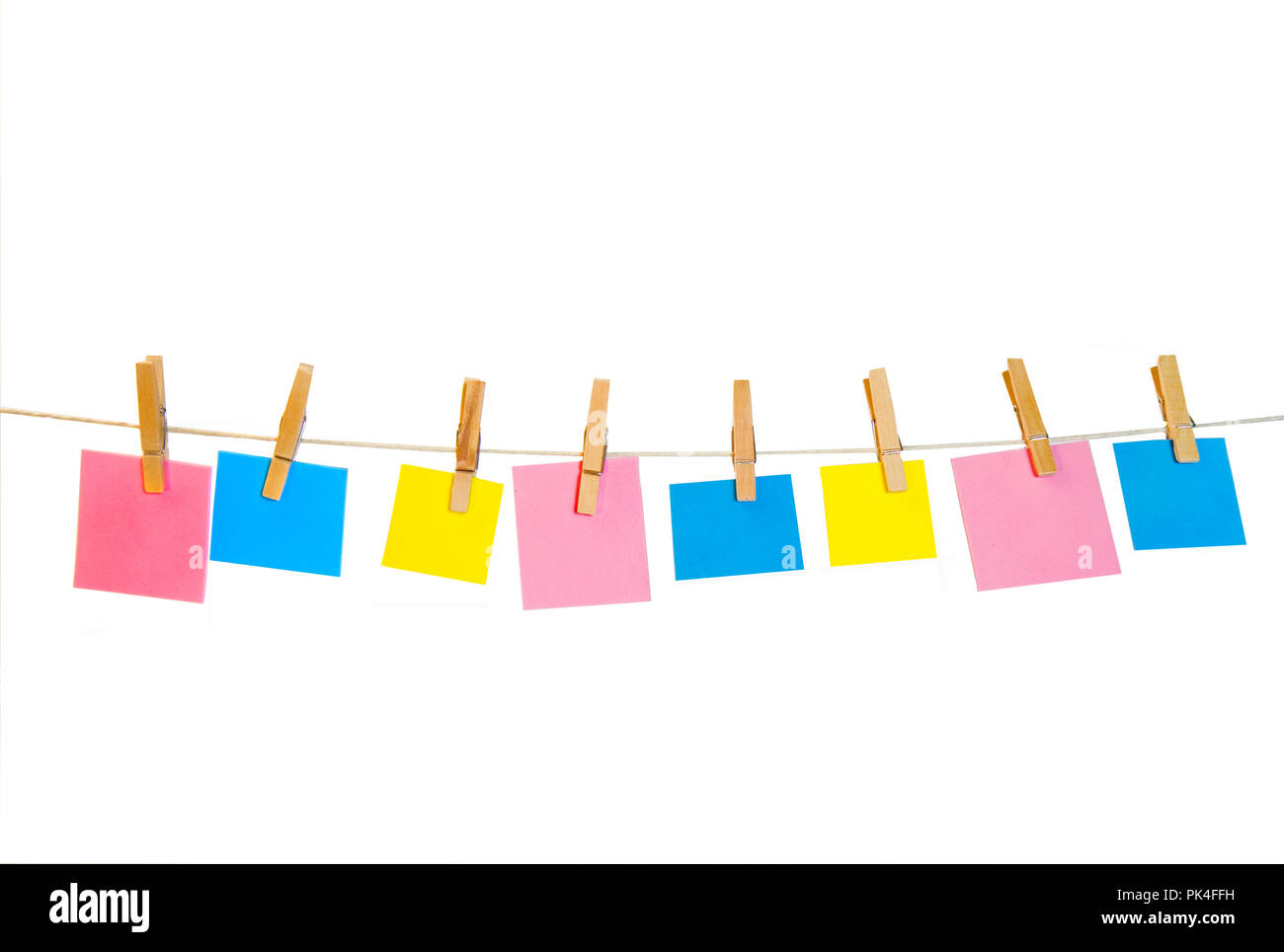 Concept image of tiny clothespins holding different color notes on ...