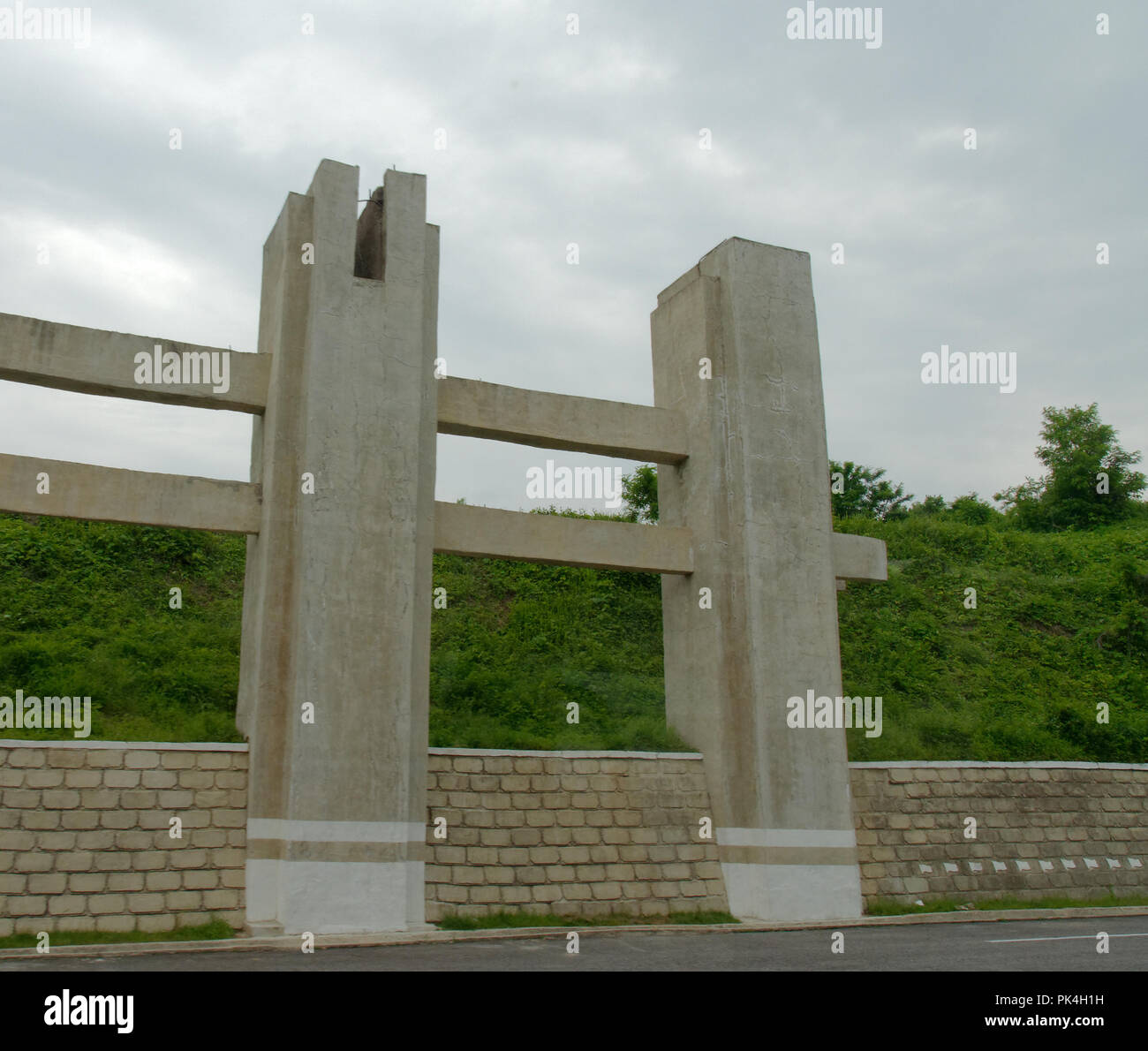 Pyongyang Highway Sign Unfinished construction along the Reunification Highway between ...