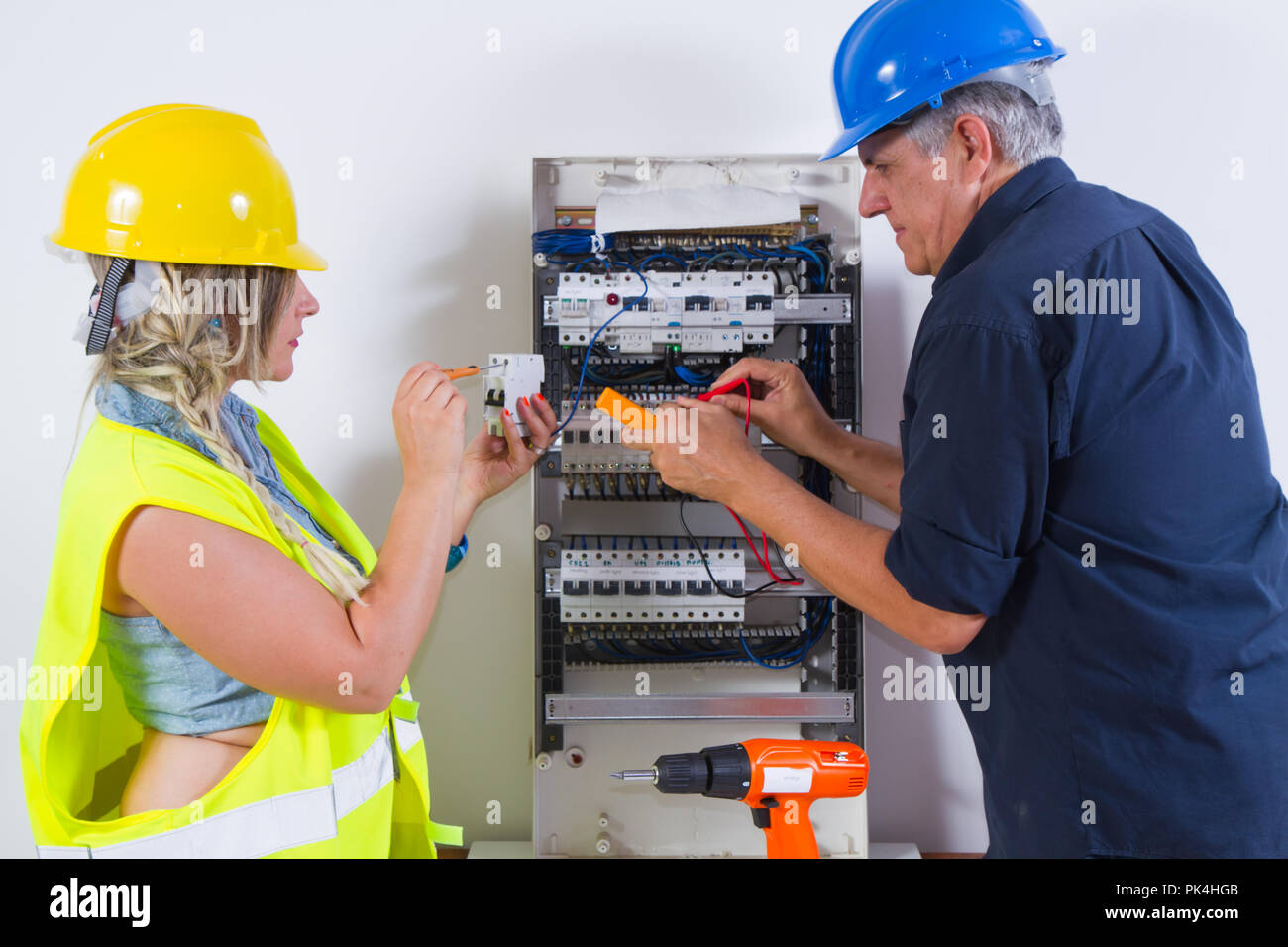 electricians at work in a plant Stock Photo Alamy