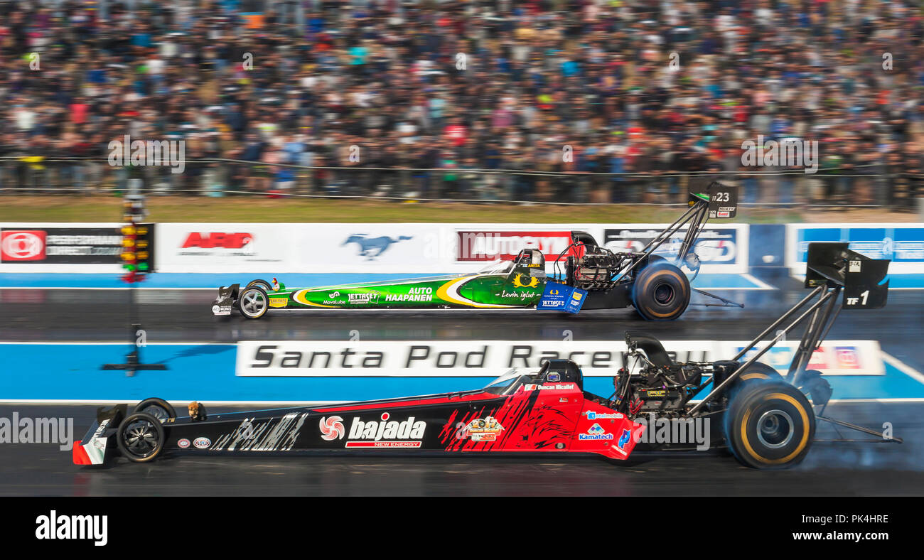 Top Fuel Drag racing at Santa Pod Raceway. Duncan Micallef nearside Anita Mäkelä far side. Stock Photo