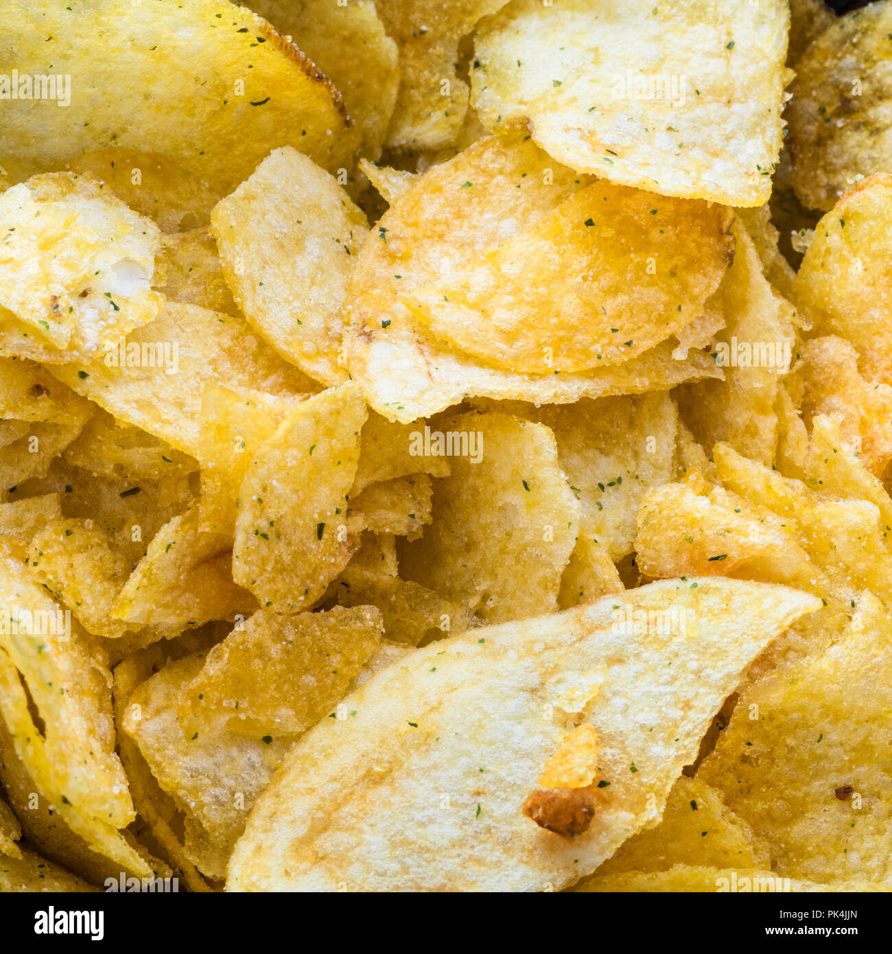 many potato chips with herbs flavor close up Stock Photo