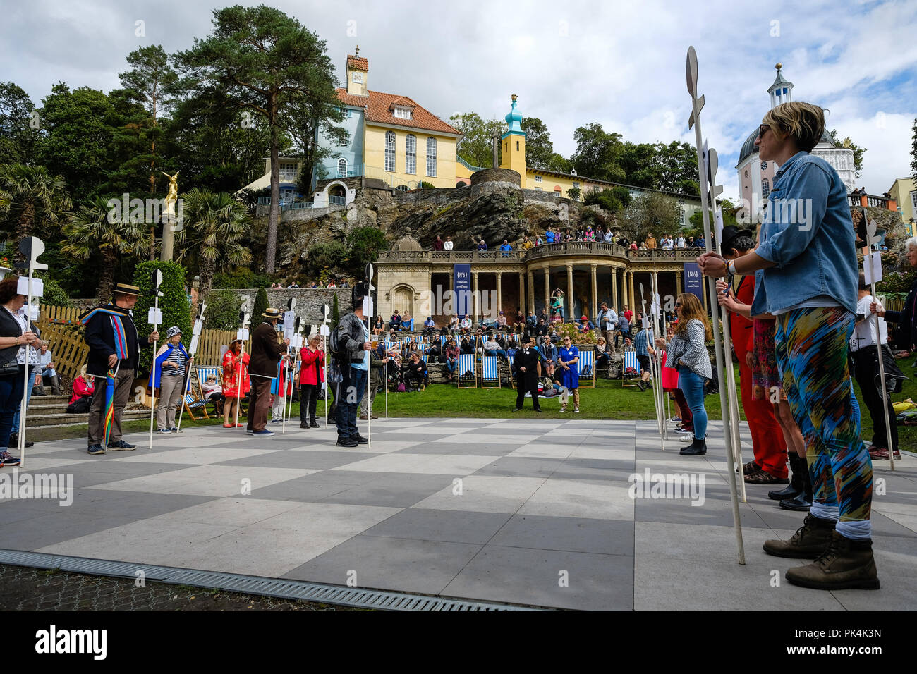 Human Chess from The Prisoner at Festival No 6 on Friday 7 September 2018 held at Portmeirion, Gwynedd, North Wales.  Pictured: The Six of One society play out a famous scene from the Episoce 'Checkmate' from TV series The Prisoner on a permanent chess board laid out for the purpose in the Central Piazza. Picture by Julie Edwards. Stock Photo