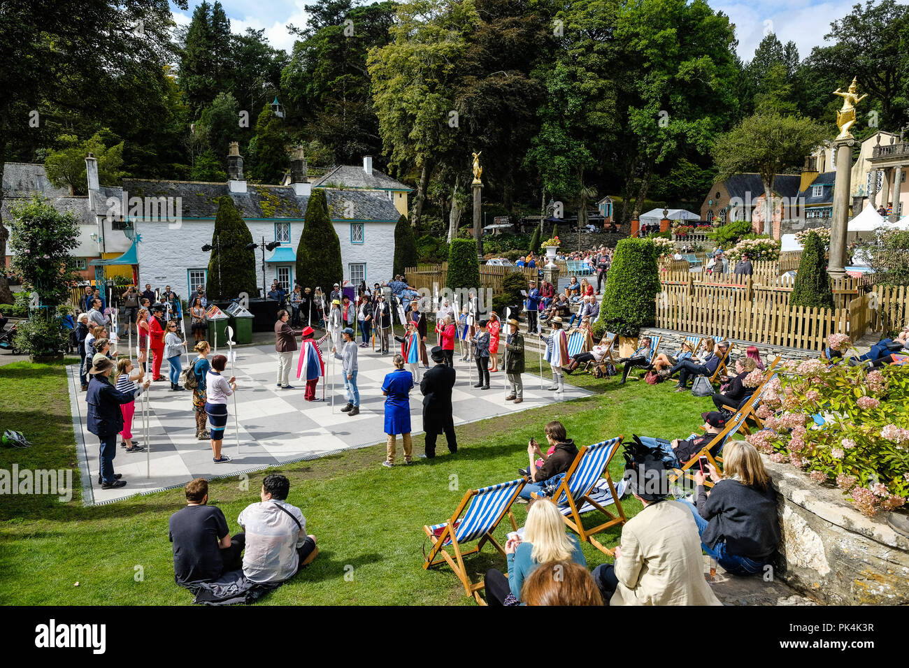Human Chess from The Prisoner at Festival No 6 on Friday 7 September 2018 held at Portmeirion, Gwynedd, North Wales.  Pictured: The Six of One society play out a famous scene from the Episoce 'Checkmate' from TV series The Prisoner on a permanent chess board laid out for the purpose in the Central Piazza. Picture by Julie Edwards. Stock Photo