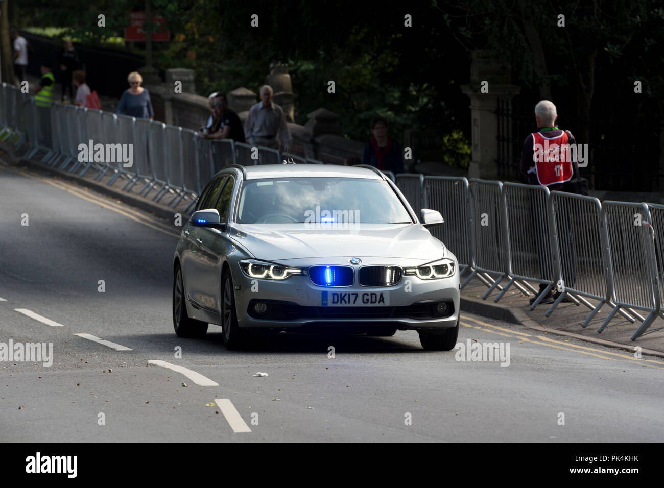 Official car with blue flashing lights at the Tour of Britain cycle race, Leamington Spa, UK Stock Photo