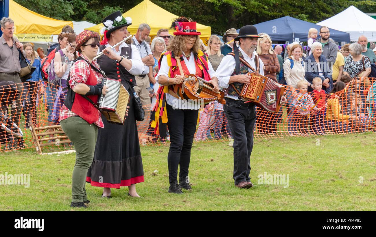 Findon, Sussex, UK; 8th September 2018; Four Folk Musicians in Traditional Costumes Play at a Country Fair Stock Photo