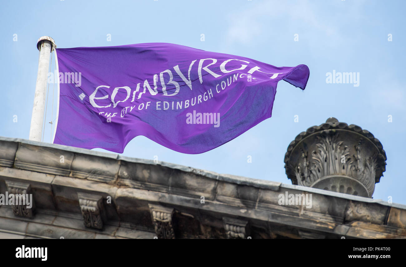 Edinburgh City Chambers, Edinburgh Council flag flys on the mast above the chambers Stock Photo