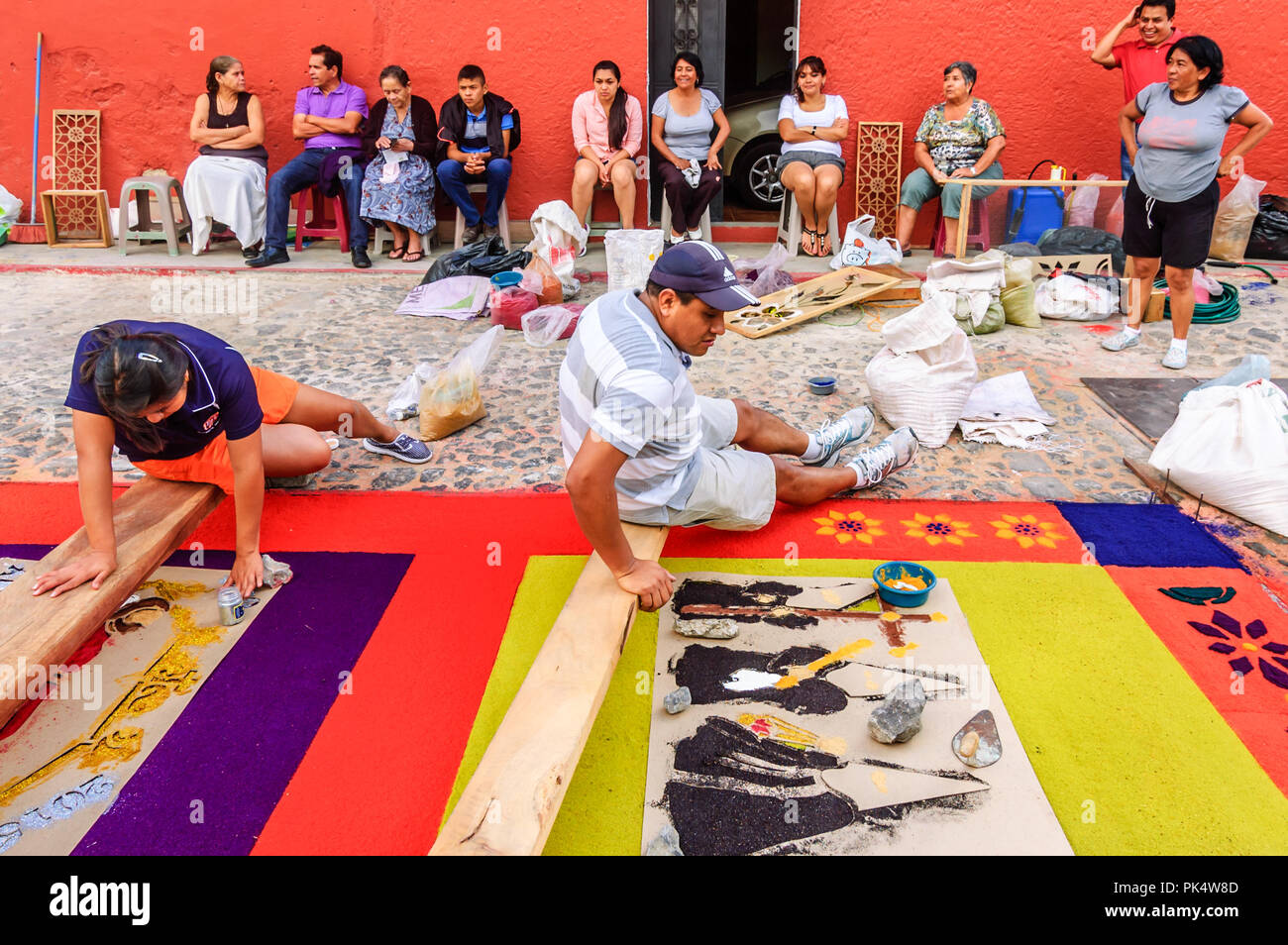 Antigua, Guatemala -  April 3, 2015: Making Good Friday procession carpet in UNESCO World Heritage Site with famous Holy Week celebrations. Stock Photo