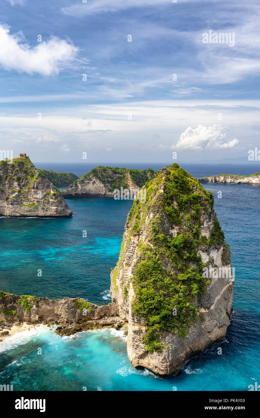 Nusa Batumategan Sea Stack surrounded by beautiful clear blue water in Nusa Penida. Stock Photo