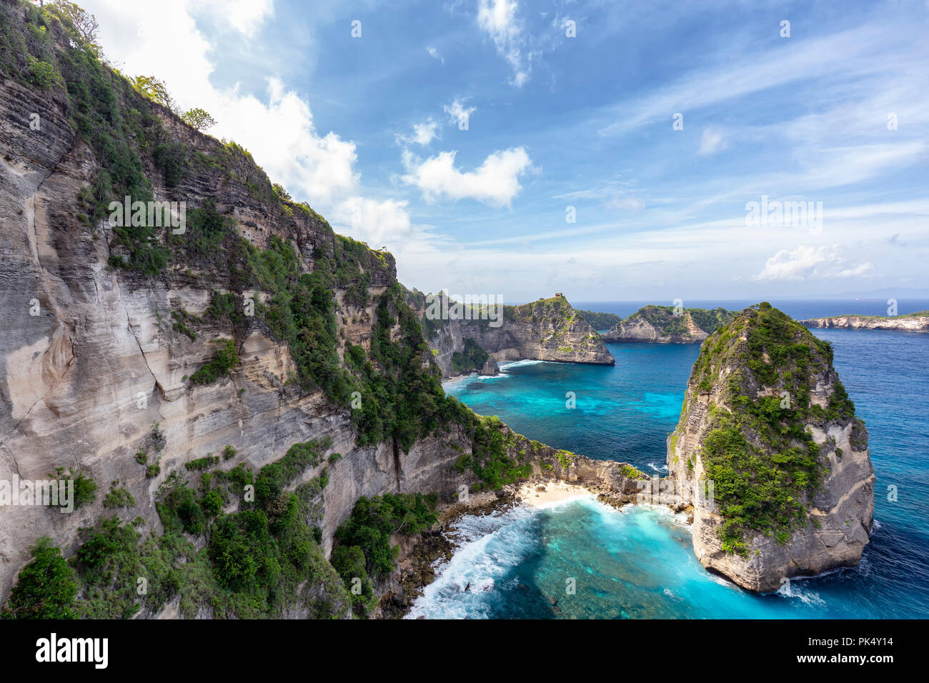 Massive white cliffs next to Nusa Batumategan on Nusa Penida in Indonesia. Stock Photo