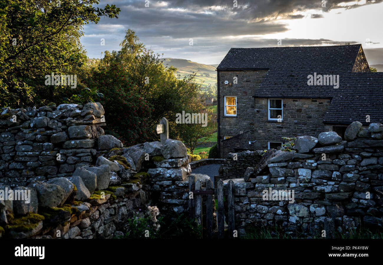 A stone cottage at dusk in the Yorkshire Dales, England, Uk. Stock Photo