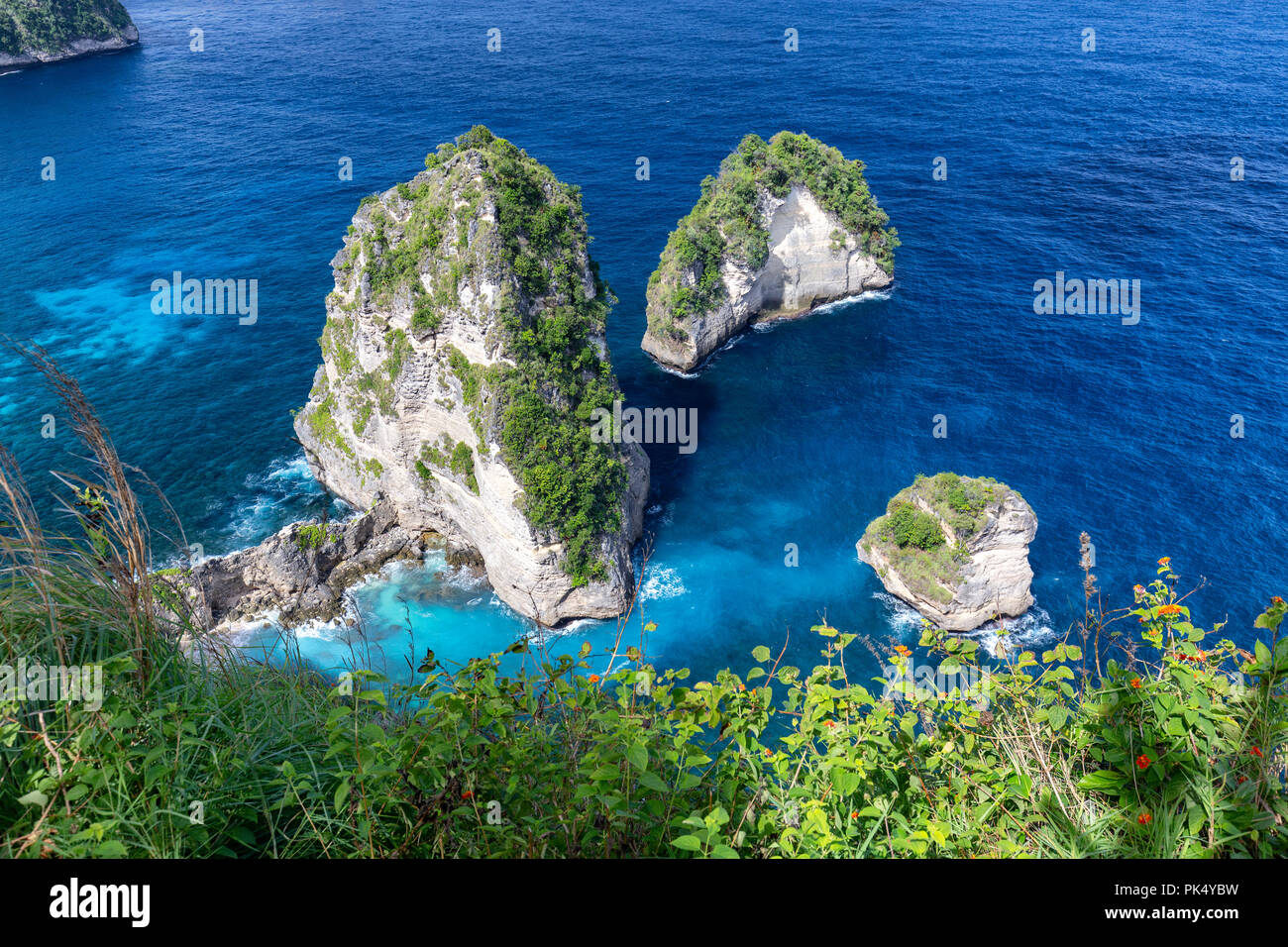 Tiny islands, part of the Raja Lima islands off the coast of Nusa Penida in Indonesia. Stock Photo