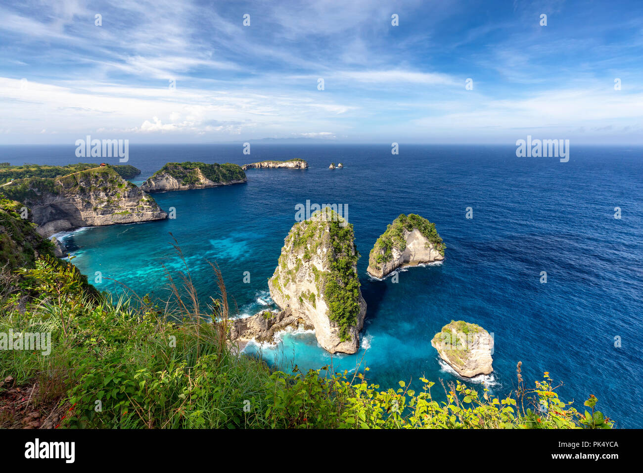 Beautiful wide angle landscape view of Raja Lima islands near Atuh Beach in Nusa Penida. Stock Photo