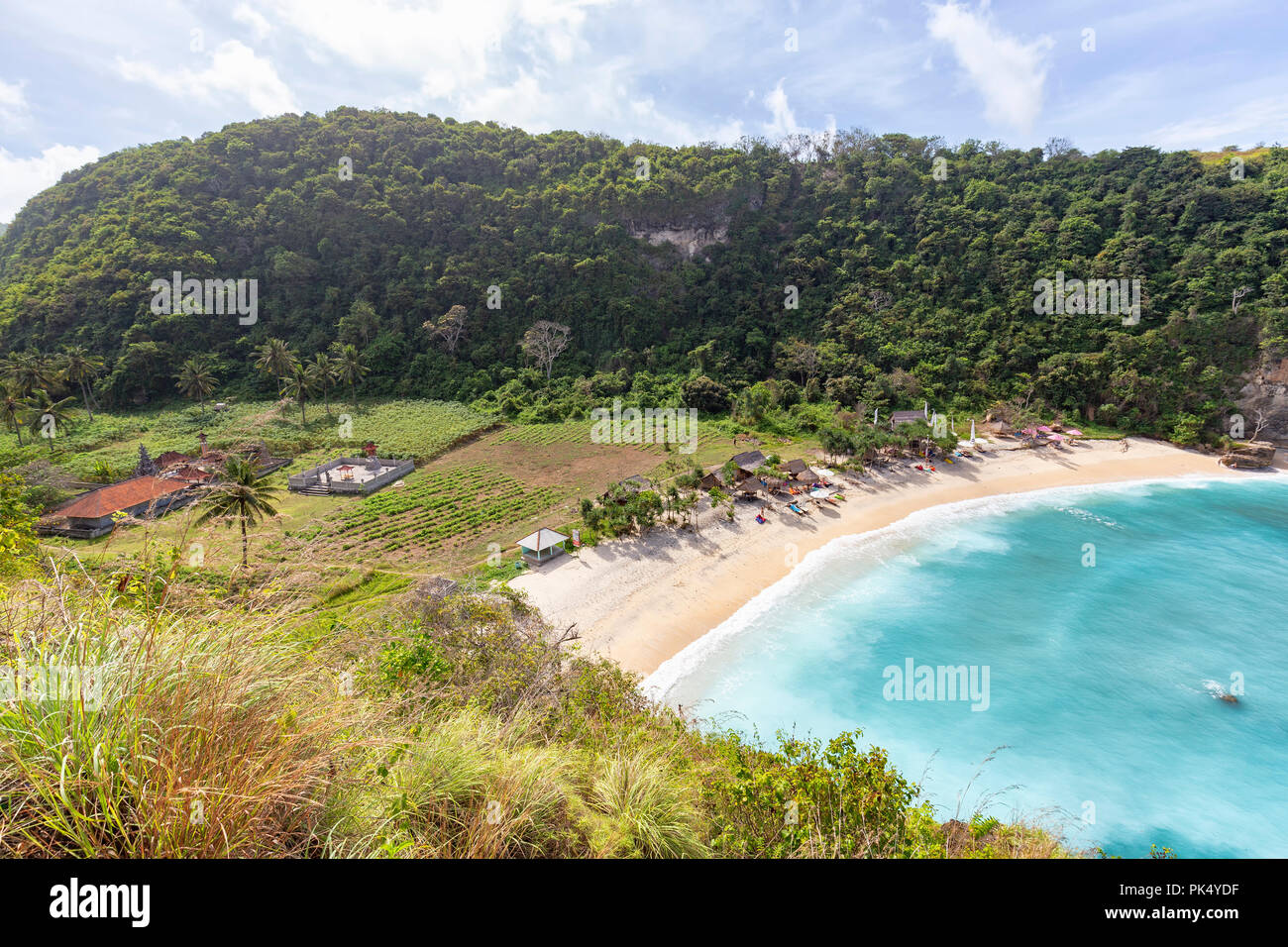 Atuh Beach as well as farm land and a Hindu temple behind it on Nusa Penida, Indonesia. Stock Photo