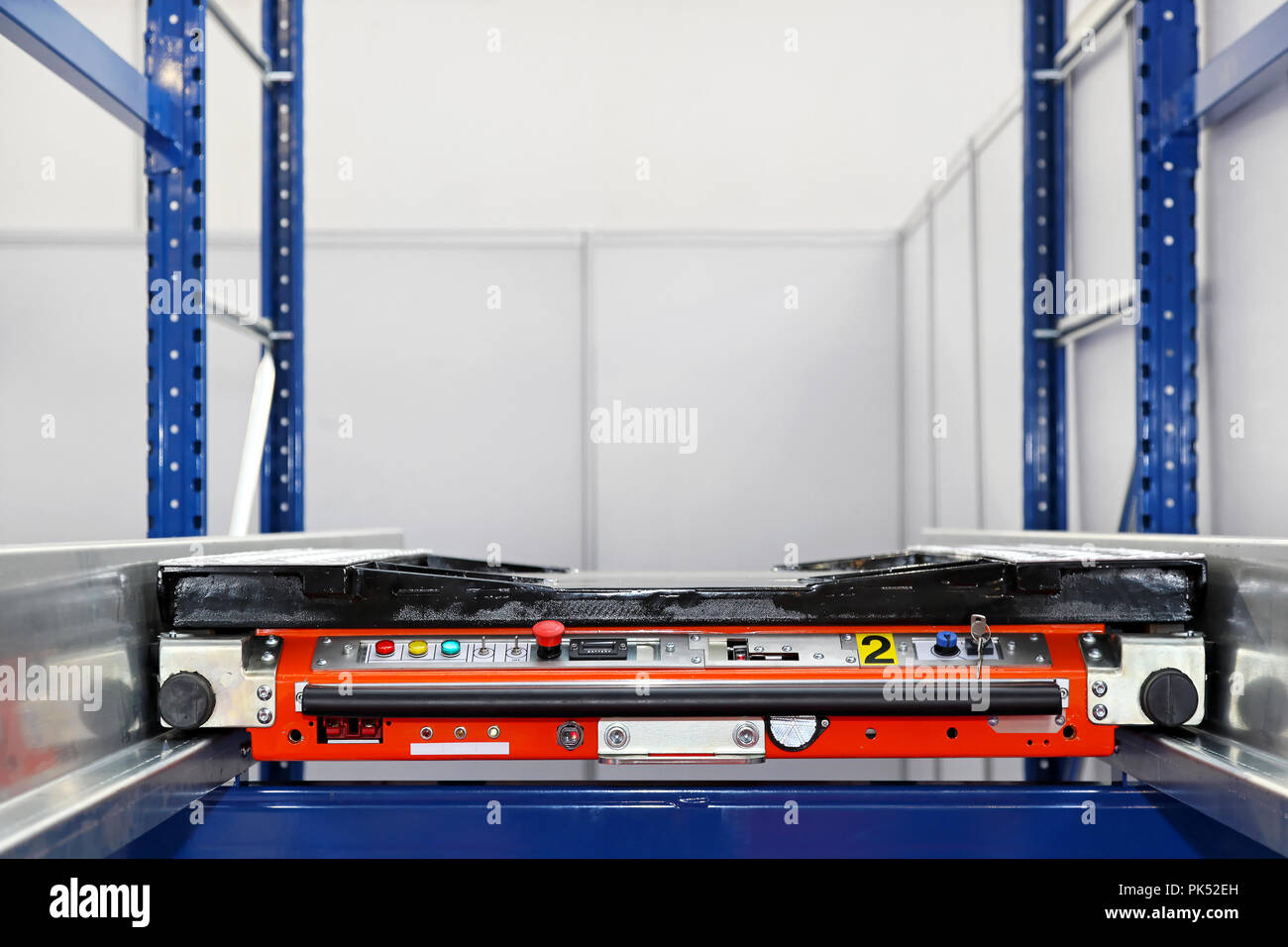 Automated pallet transport at shelves in warehouse Stock Photo Alamy