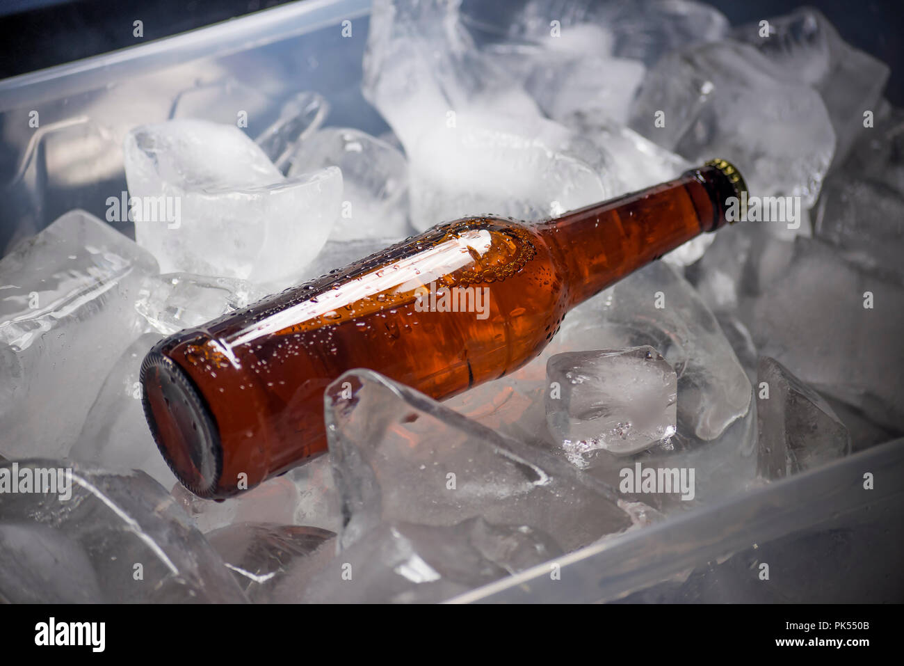 Bottles of beer on ice Stock Photo Alamy