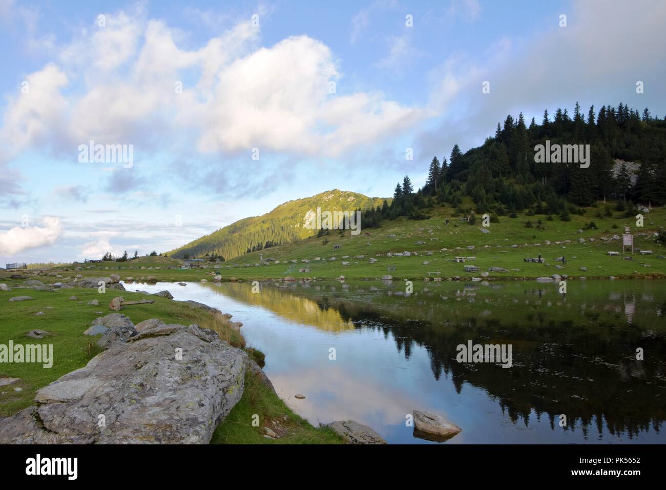 Panoramic scenic view of mountain lake with sky in background Stock Photo