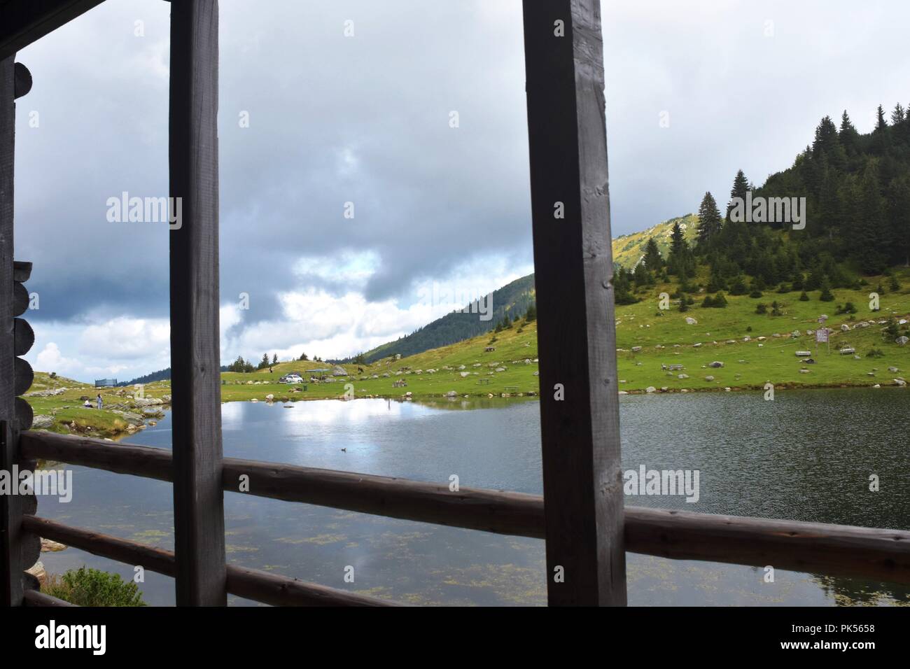 Panoramic scenic view of mountain lake with sky in background Stock Photo