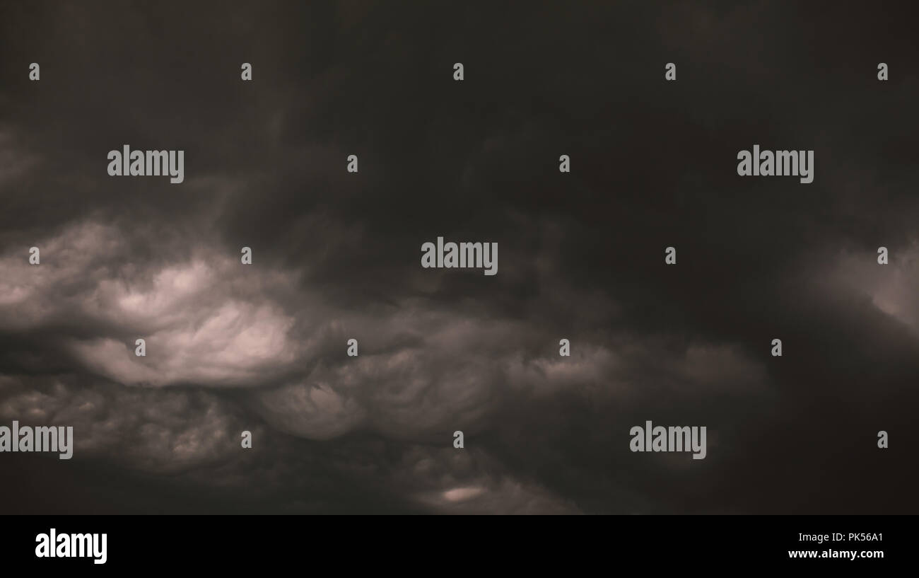 Abstract composition of big, dark and interesting clouds during bad weather. Stock Photo