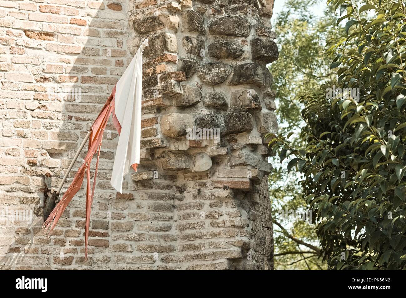 Red and white medieval flag in the Castle (Tolentino, Marche, Italy) Stock Photo