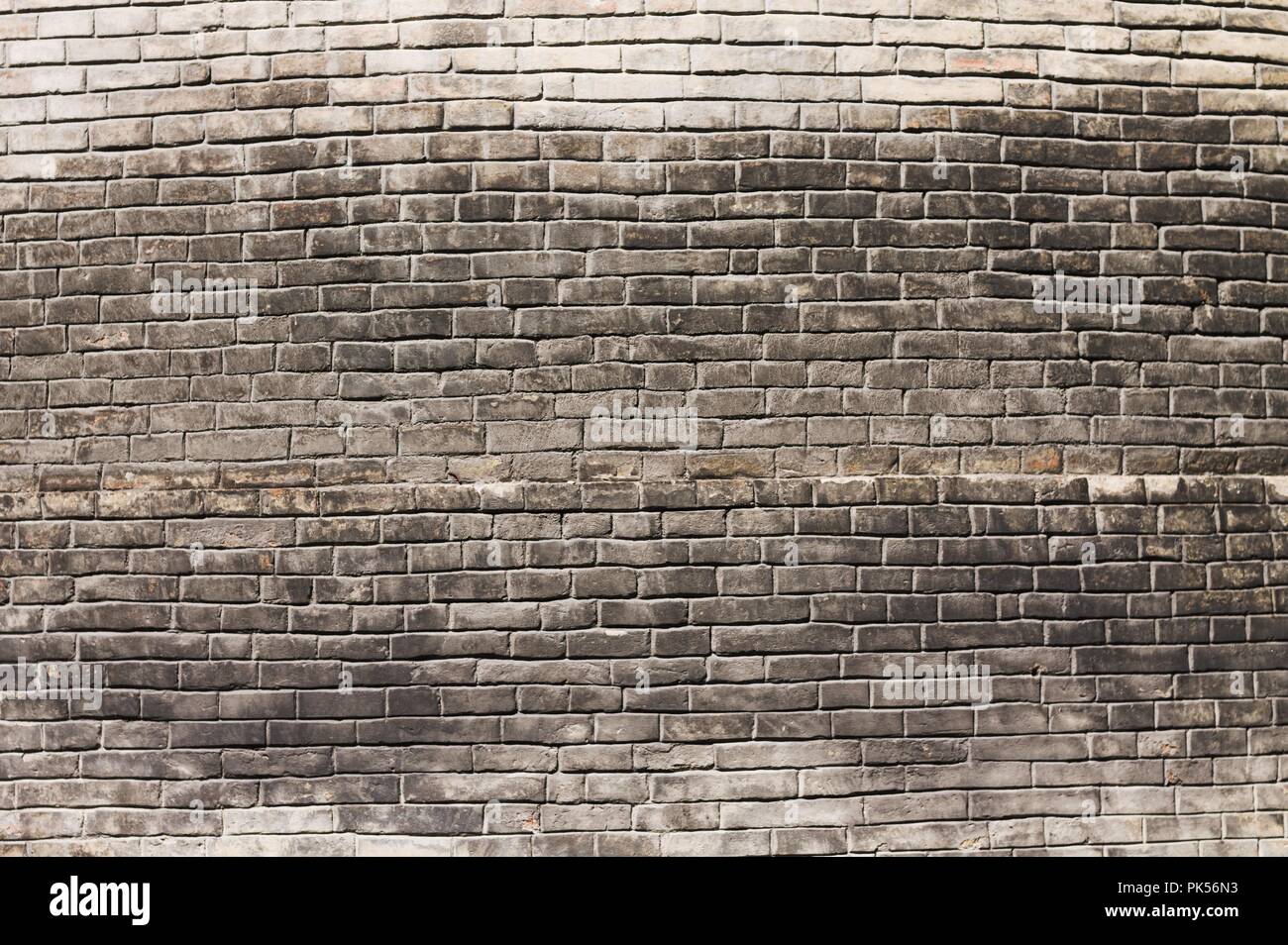 Black bricks wall background (Tolentino, Marche, Italy) Stock Photo