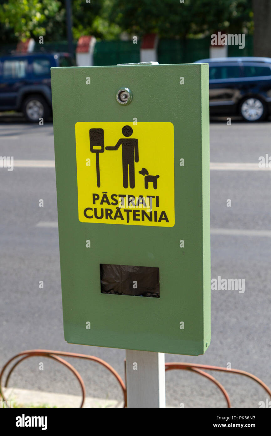 A dog poo bag dispenser (Păstraţi curăţenia) in Bucharest, Romania. Stock Photo