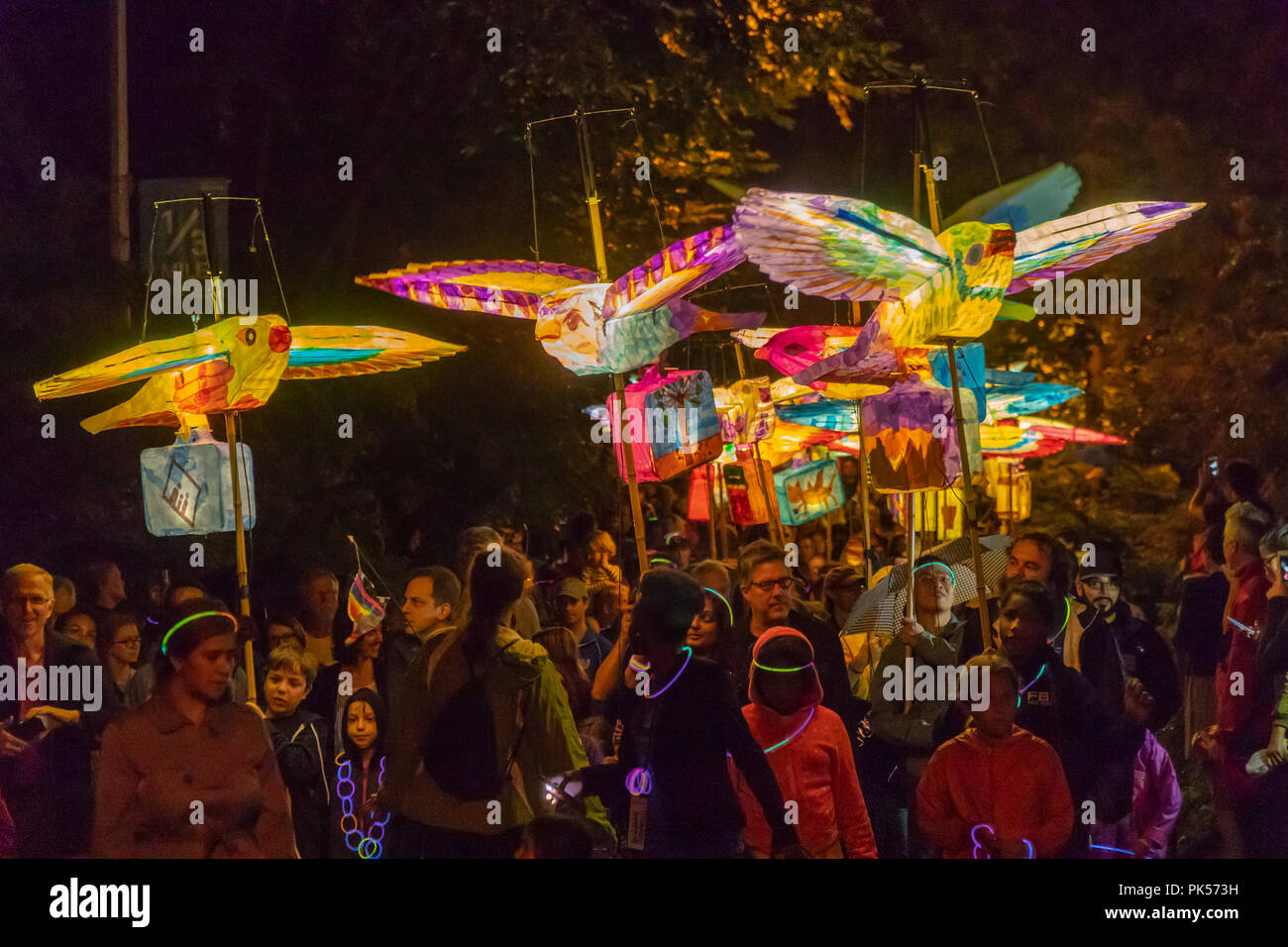 Local residents joined by Columbia University students and faculty carry lanterns created during the past week in the 7th annual Morningside Lights procession on Saturday, September 8, 2018. Produced by Columbia University Arts Initiative and Miller Theatre, the paper-mâché illuminated lanterns  fulfilled the theme of this years' procession; 'Flight', evoking human migration. The parade wound its way through Morningside Park eventually ending at the Columbia campus.  (© Richard B. Levine) Stock Photo
