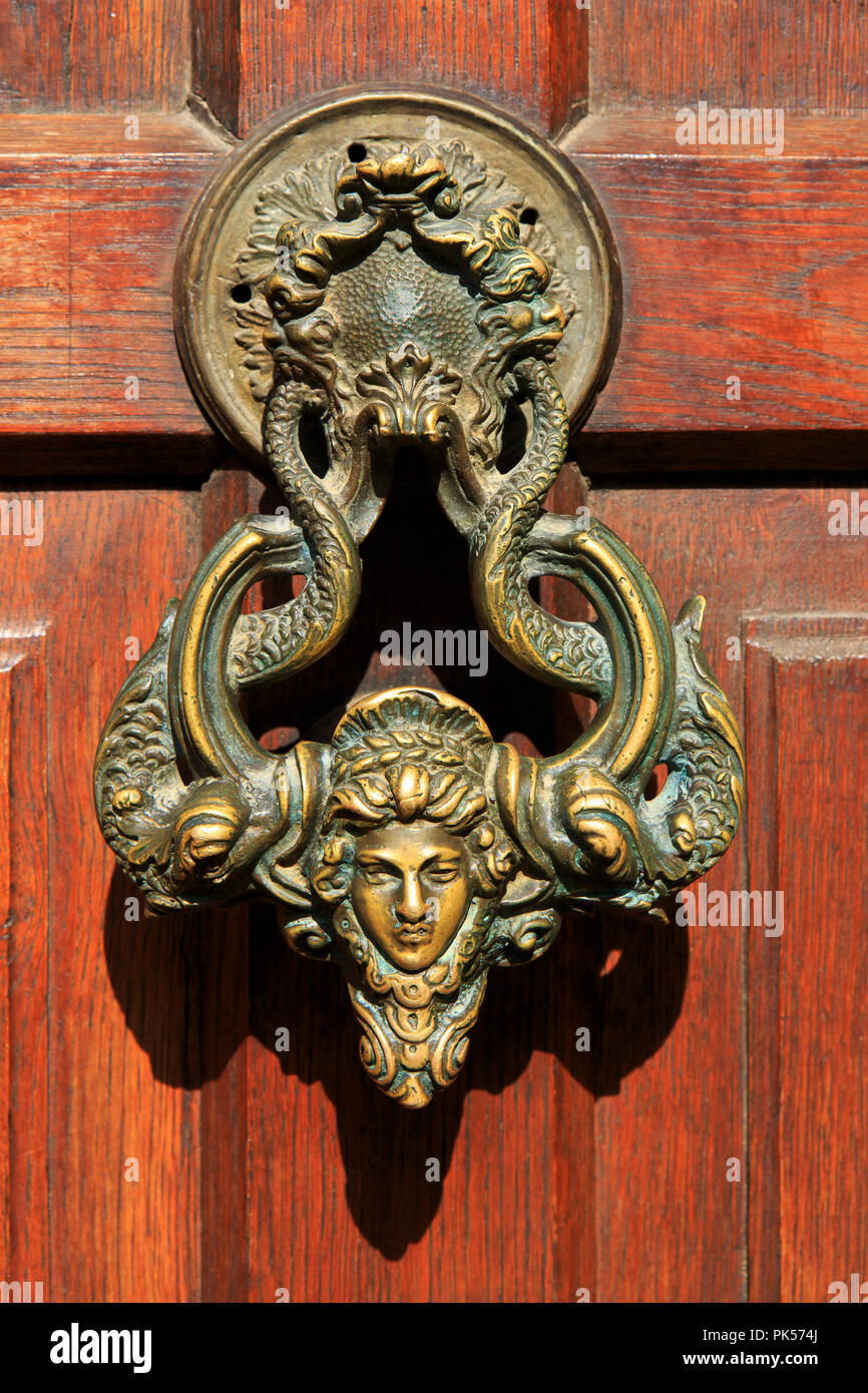 A beautiful copper door knocker decorated with Medusa's Head at the entrance door to Bran Castle in Bran (Transylvania), Romania Stock Photo