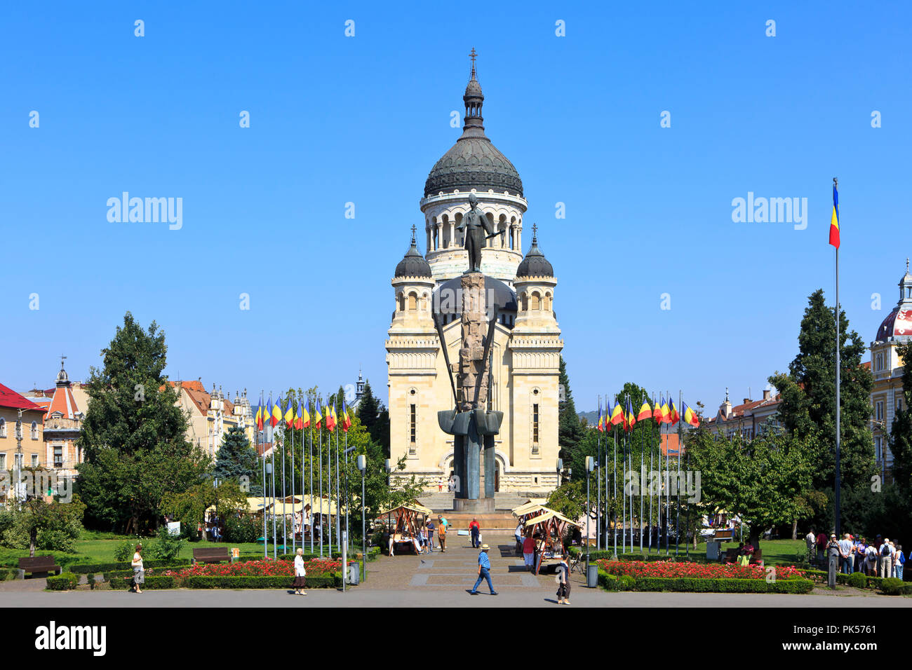 Dormition of the Theotokos Cathedral (1933) and statue of the Transylvanian Romanian lawyer Avram Iancu (1824-1872) in Cluj-Napoca, Romania Stock Photo