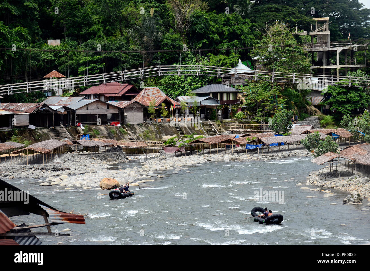 Village of Bukit Lawang, Sumatra, Indonesia, men on rafting buyos Stock Photo