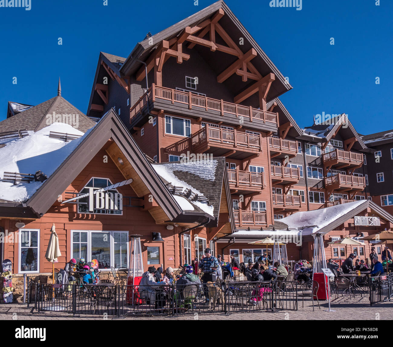 Bluebird afternoon at the Tbar and Ski Hill Grill at the base of Peak