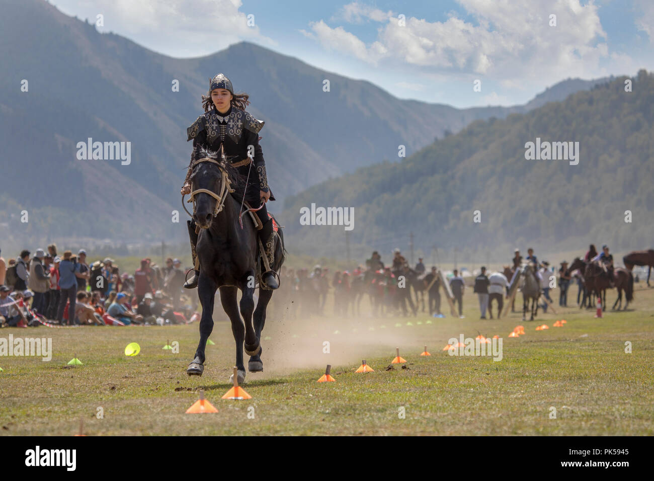 Lake Issyk-Kul, Kyrgyzstan, 6th September 2018: Woman competing in archery on horseback game Stock Photo