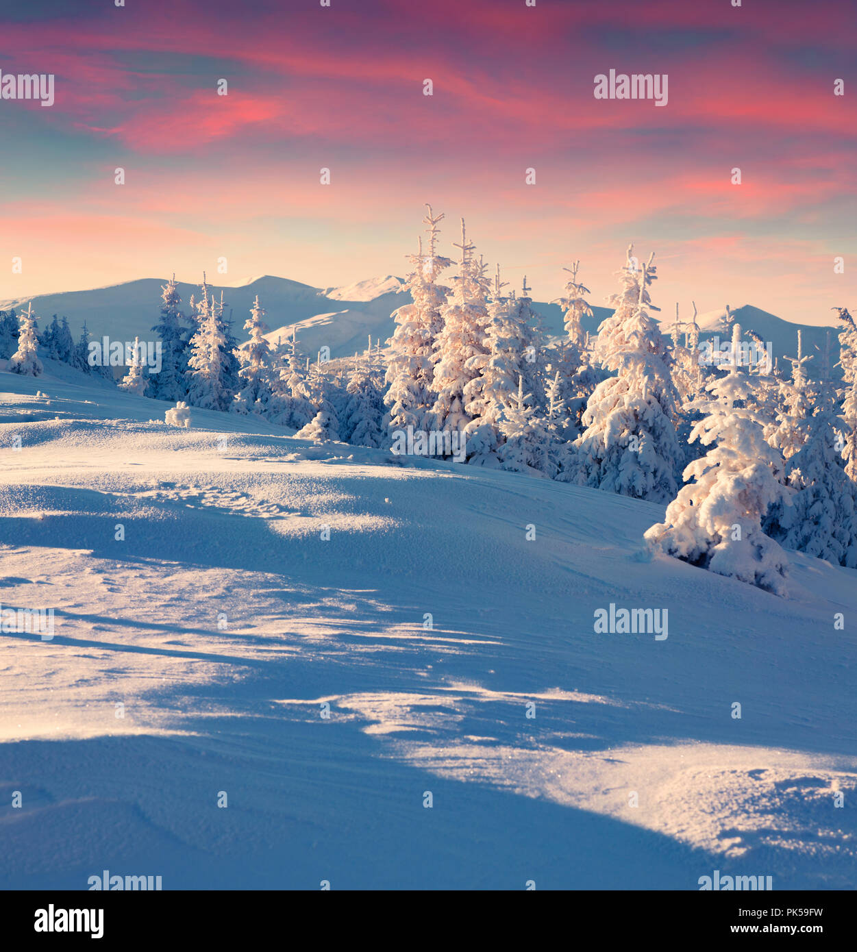 Colorful winter sunrise in the mountains. Happy New Year! Instagram toning. Stock Photo