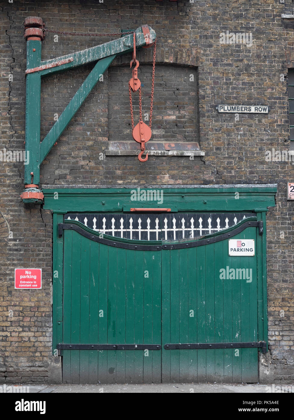 WHITECHAPEL, LONDON Gates and Hoist on Victorian warehouse on Plumbers