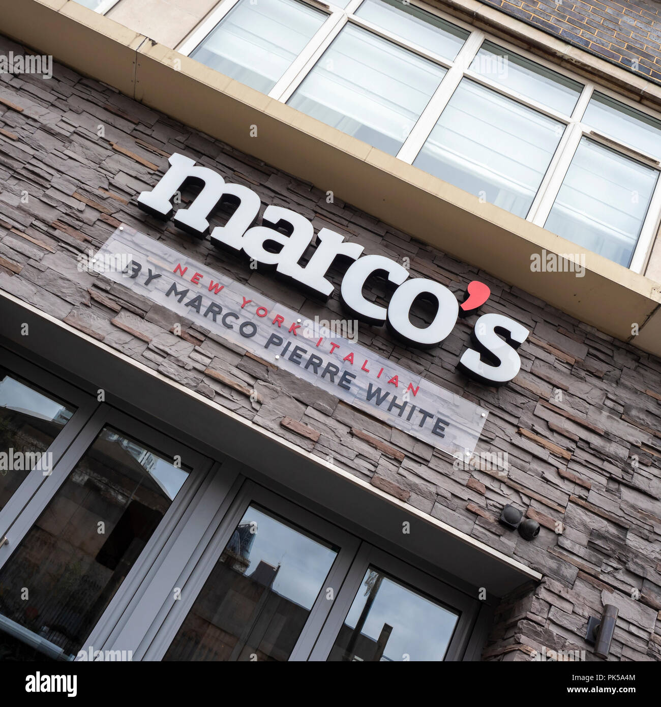 LONDON, UK - SEPTEMBER 09, 2018:  Sign on exterior of Marco's Restaurant in Brick Lane owned by Chef Marco Pierre White Stock Photo