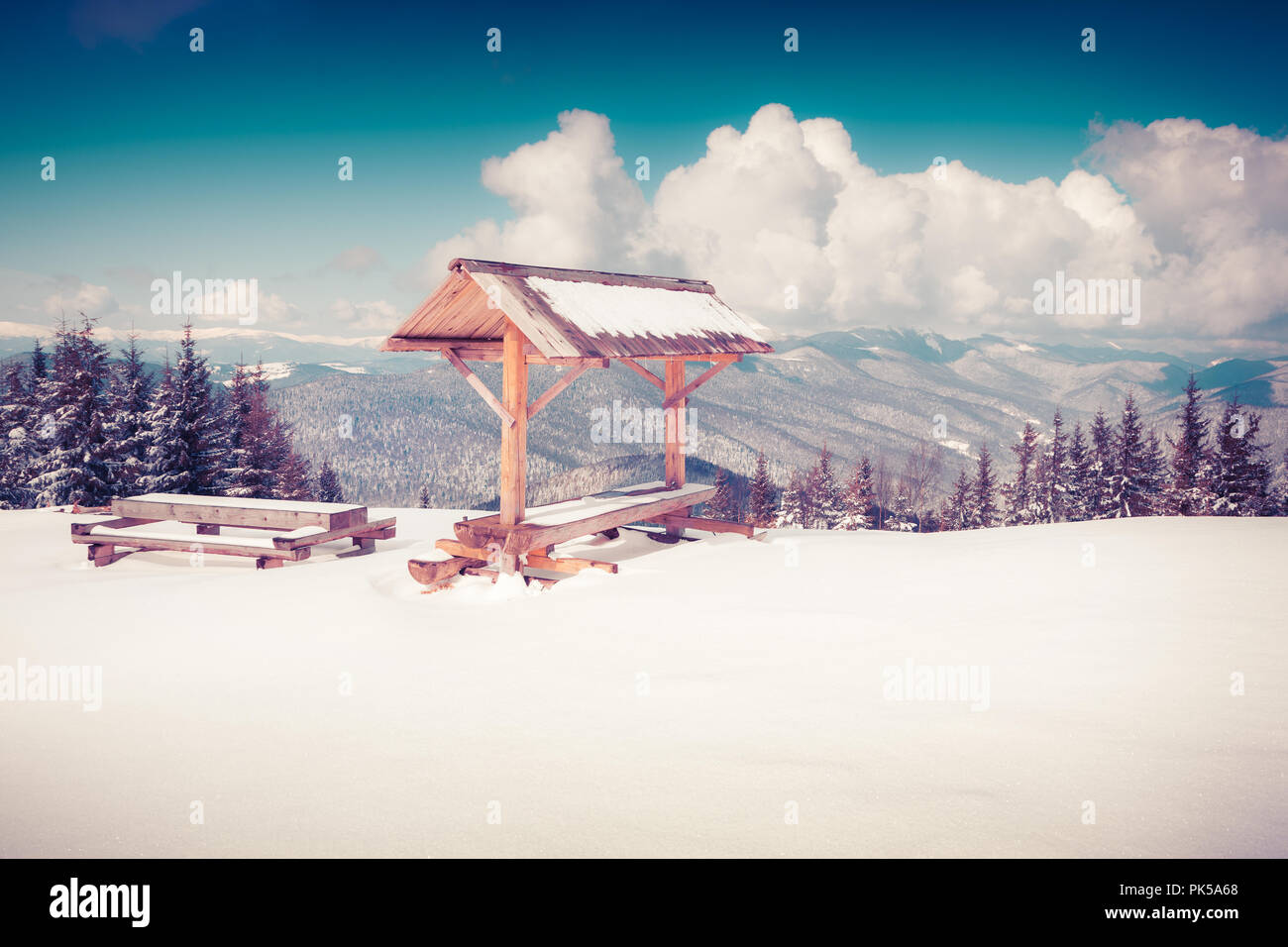 Resting plase on the top of snowy mountains. Instagram toning. Stock Photo