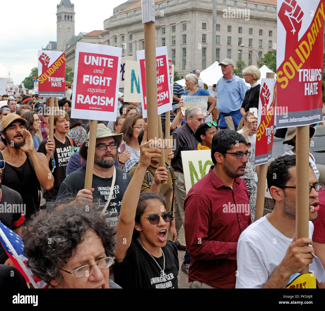 Protesters against hate and racism leave Freedom Square in Washington DC on August 12, 2018 to march to a nearby alt-right rally. Stock Photo