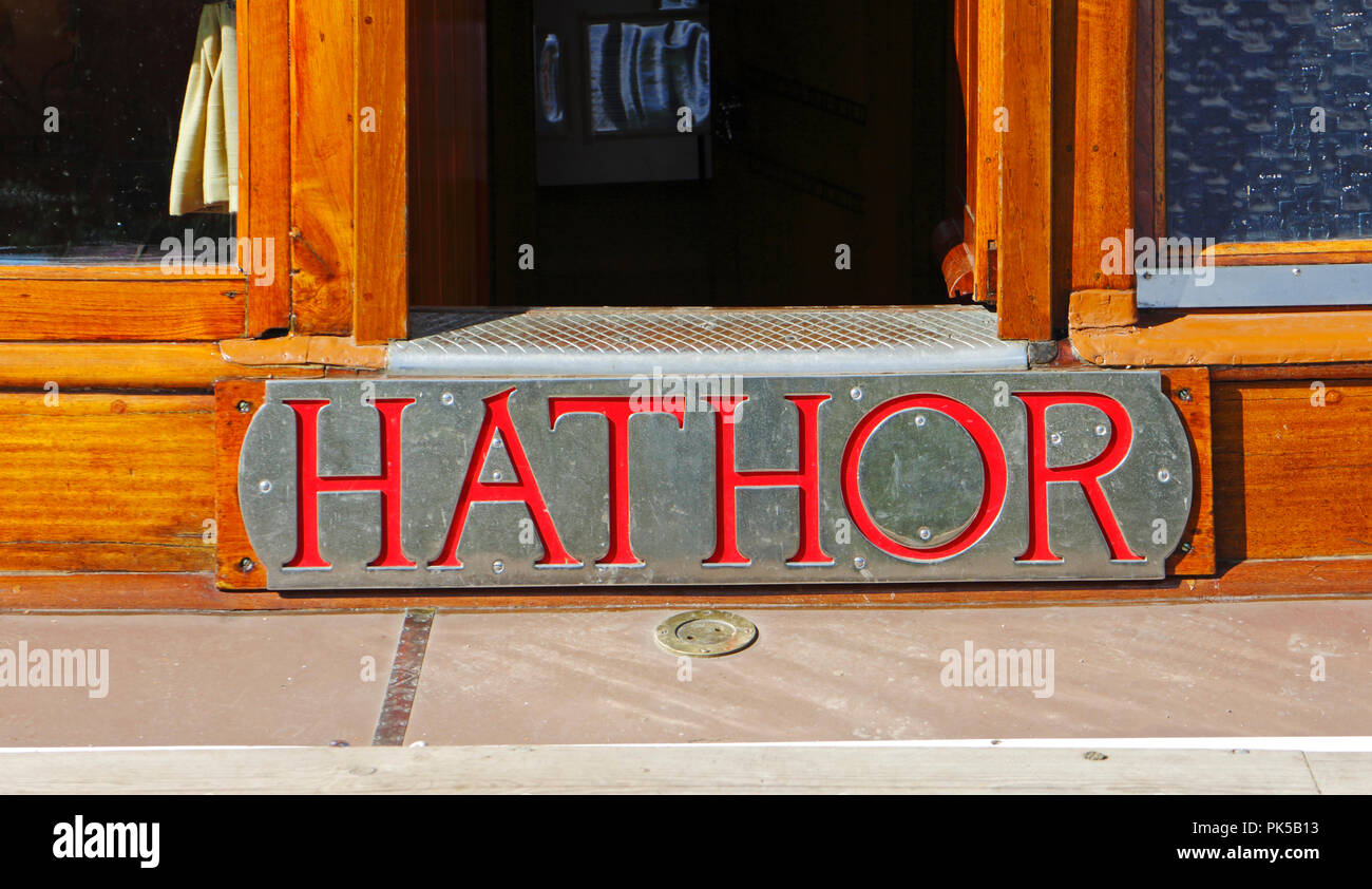 A view of the nameplate of the Norfolk Pleasure Wherry Hathor moored on the River Ant by How Hill, Norfolk, England, United Kingdom, Europe. Stock Photo