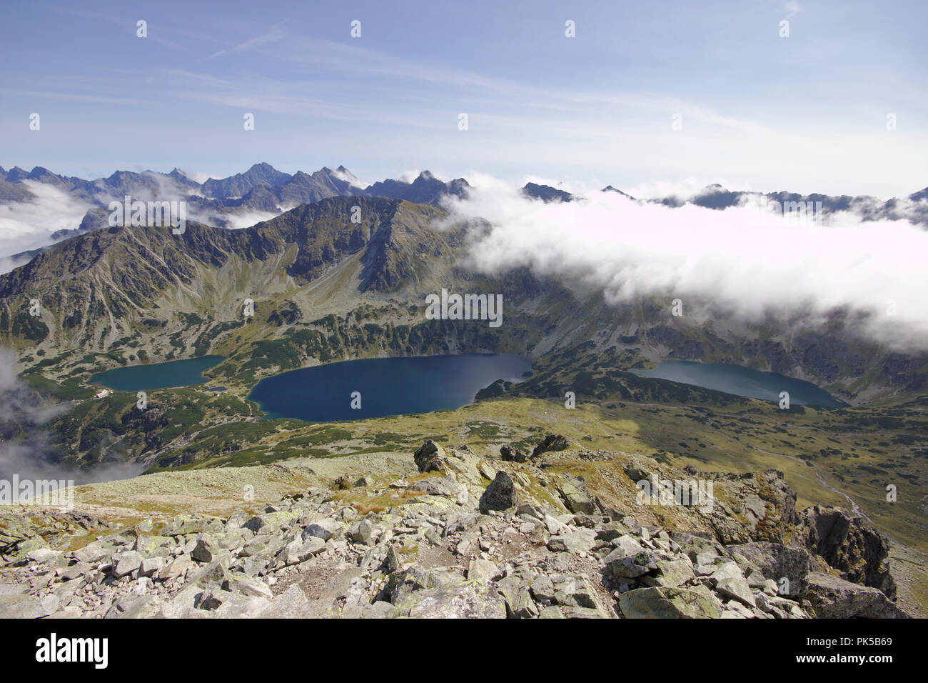 View from Kozi WIerch on Orla Perc ridge to Przedni Staw Polski,  Wielki Staw Polski and Czarny Staw Polski, Valley of the 5 lakes, High Tatra, Poland Stock Photo