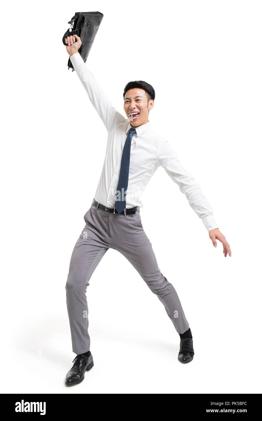 Cheerful young businessman cheering Stock Photo