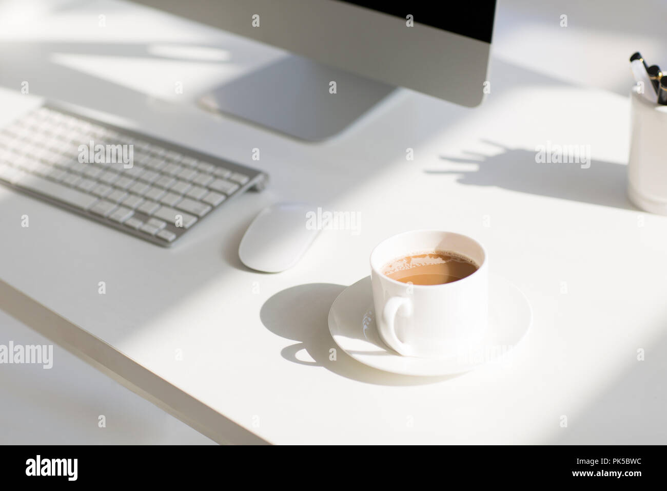 Coffee on office desk Stock Photo - Alamy