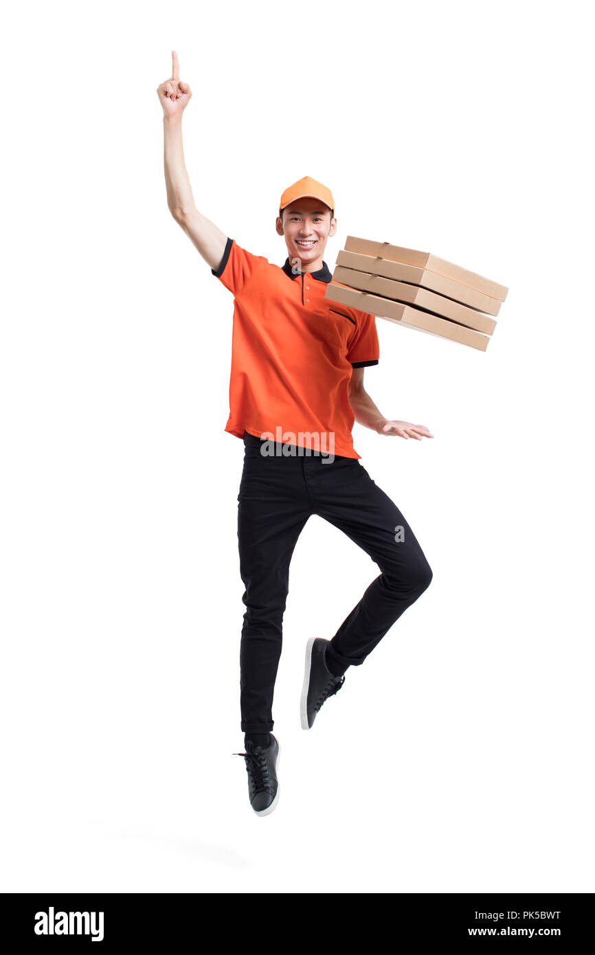 Cheerful pizza delivery person jumping Stock Photo Alamy