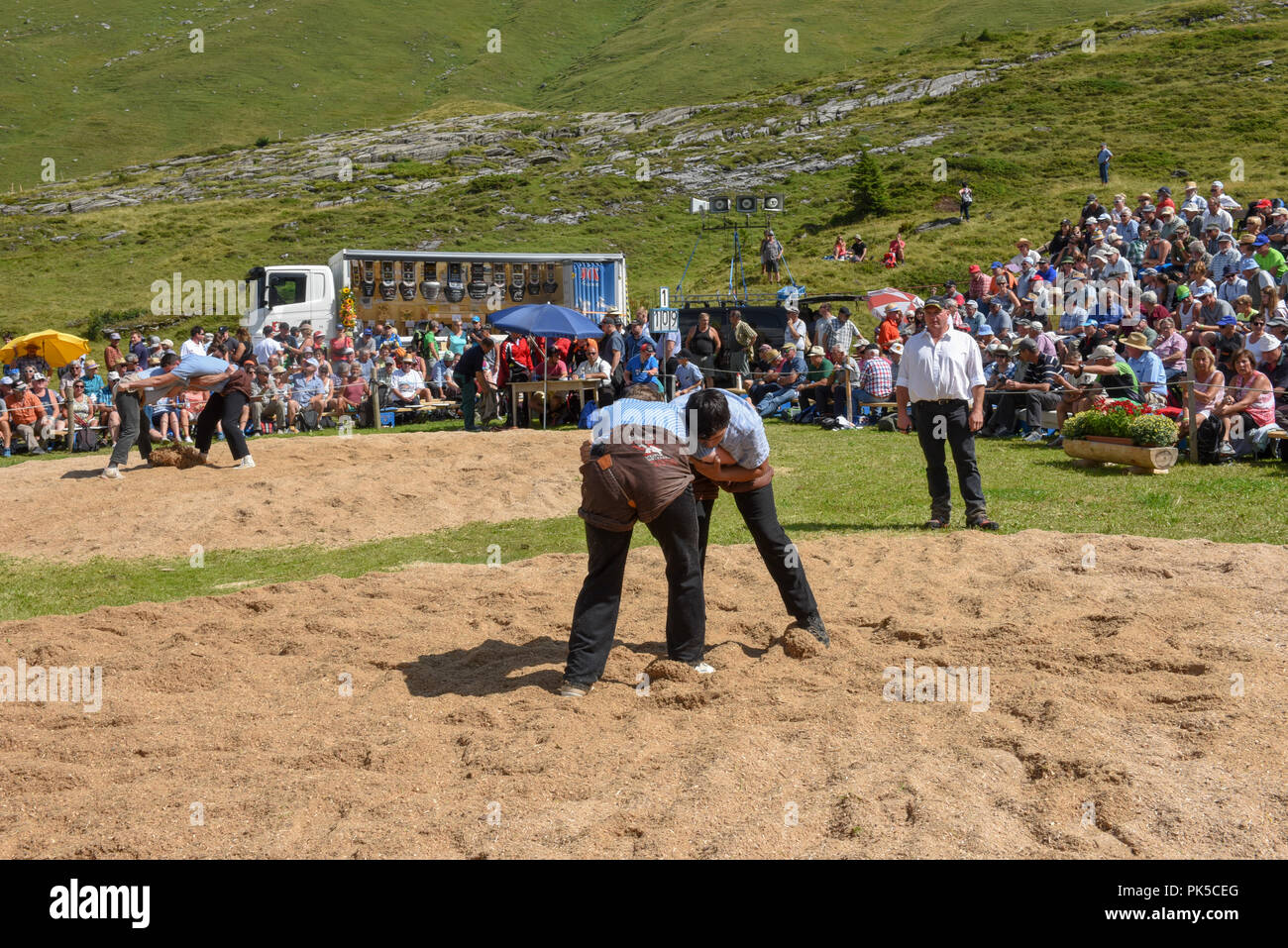 Engstlenalp, Switzerland - 4 August 2018: Two Swiss taking part in a traditional wrestling match (called 'Schwingen') at Engstlenalp on the Swiss alps Stock Photo