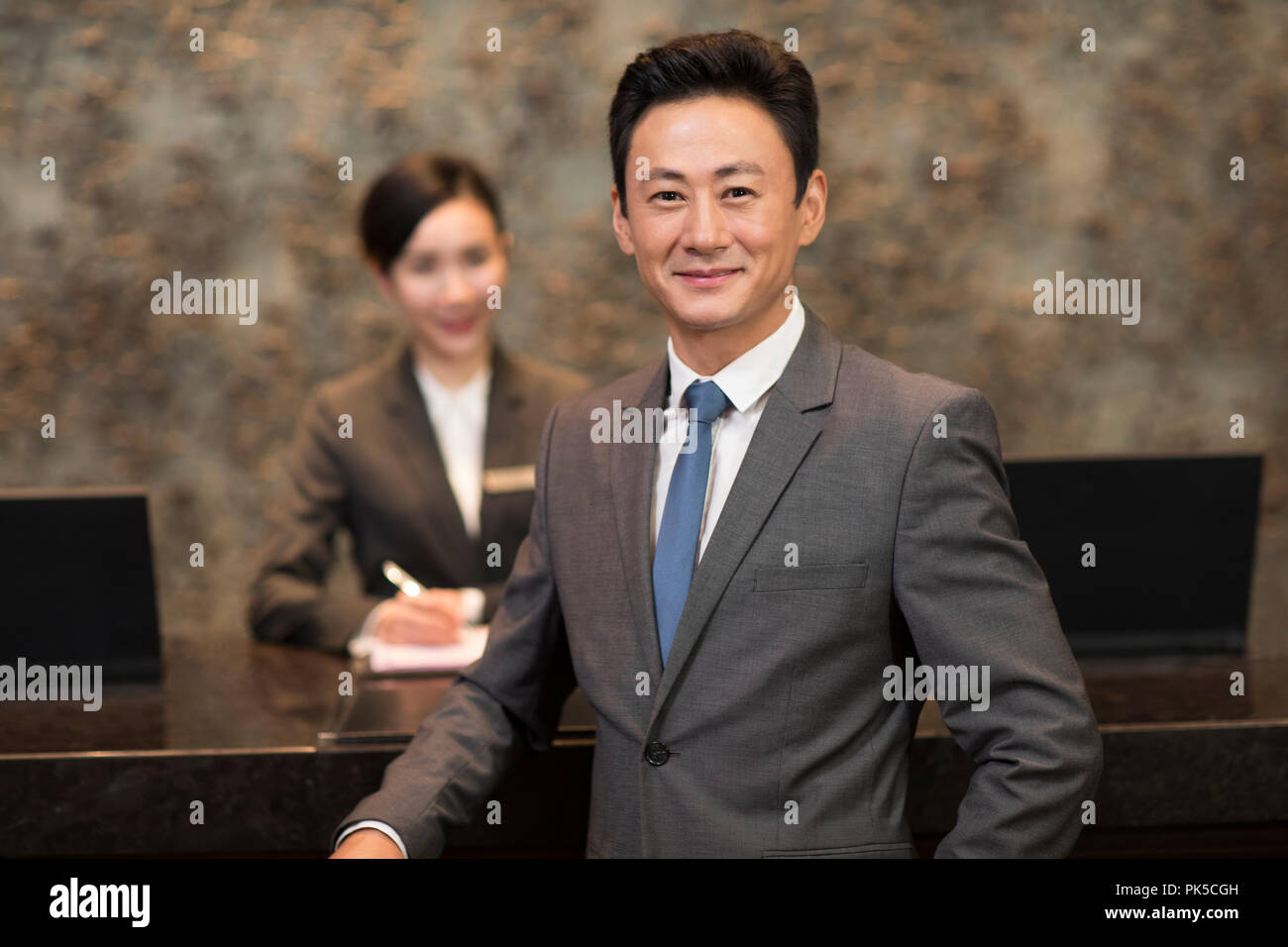 Hotel reception customer manager hi-res stock photography and images ...