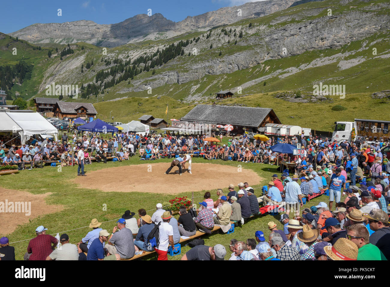 Engstlenalp, Switzerland - 4 August 2018: Two Swiss taking part in a traditional wrestling match (called 'Schwingen') at Engstlenalp on the Swiss alps Stock Photo